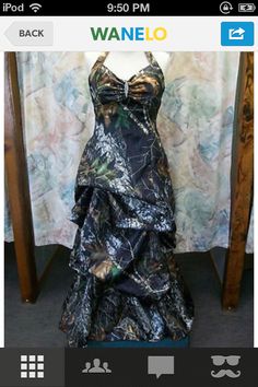 a mannequin wearing a dress made out of realtree camo and blue fabric