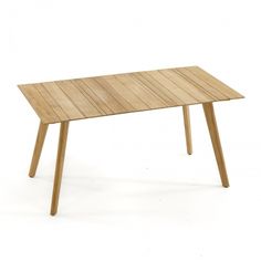 a wooden table sitting on top of a white floor