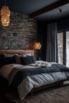 a bedroom with stone walls and flooring, along with a bed that has pillows on it