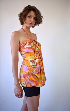 "Psychedelic print top. Made of polyester Halter top is one of a kind vintage piece. In great vintage condition. You will receive the exact item shown in the picture. All the clothes in my shop are washed and stored with care. For reference, model is 5'7\" and measures 32-28,5-36. Wears US size 8, UK size 10, EU size 38. Estimated size: S To be sure it would fit please check measurements below. M E A S U R E M E N T S - taken seam to seam lying flat - not doubled Armpit to armpit 14,5\"=37 cm Le Summer Blouse With Graphic Print, Fitted Summer Tops With Retro Print, Summer Beach Top With Vintage Print, Summer Beach Tops With Vintage Print, Retro Summer Printed Blouse, Retro Multicolor Print Tops For Beach, Spring Vacation Top With Vintage Print, Summer Vintage Print Patterned Tops, Retro Multicolor Print Beach Tops