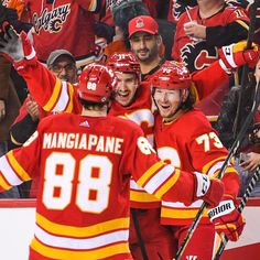 the hockey players are congratulating each other