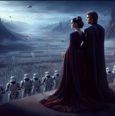 two people standing next to each other with storm troopers in the background