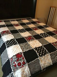 a black and white checkered bedspread on a bed