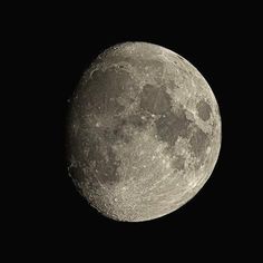 the full moon is seen in black and white with no clouds on it's side