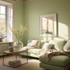 a living room with green walls and white furniture