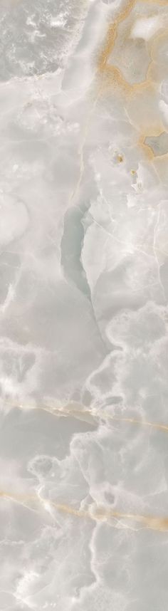 an aerial view of the ocean with yellow and white paint on it's surface