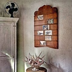 an antler's head on top of a table in front of a door