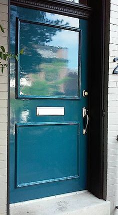 a blue door with a sign on it