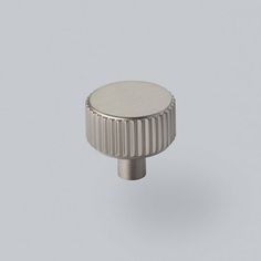 a metal knob on a gray background