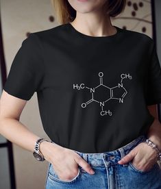 Hello, Welcome to My Store! The T-shirt with 'Caffeine Formula' Printed by Printing Machine with High Quality and There is 2 Different Color Options for Your Choice. The Print Material is Very Durable for Washing with Machine or Hand Wash.  The T-Shirt Material is 100% Cotton. If you have any question, please leave a message. Caffeine Formula, Black And White Tshirt, Womens Graphic Tees, Printing Machine, Graphic Tees Women, Printed Materials, White Tshirt, 2 Colours, Womens Clothing Tops