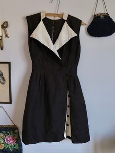 This is a beautiful vintage 40s/50s wool dress made by Anita Mode. The material is very thick, and has geometric patterns on the fabric throughout, which is very hard to capture in photos. It has a collared neck and chest line, a row of buttons hidden between the skirt pieces. Also showing a cream white color in underneath giving the dress so much depth and details. The dress is in brown and cream white. Has a metal zipper closure in the back. Fits like a modern size S/M. The dress is in great v Retro Brown Dress With Buttons, Brown Button Up Dress, White Wool Dress, Early 60s Fashion, Autumn Angel, 70s Summer, 50s Outfits, Cream White Color, Dope Makeup