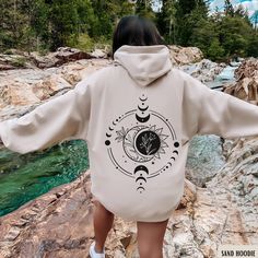 Sun and Moon Hoodie, Mystic Moon And Sun Sweater, Mystical Moon Phase Sweatshirt, Celestial TShirt, Witchy Clothes, Spiritual Tee, Moon Lover Gifts ✧ SIZING ✧ ⋒ Please check our size chart before placing an order. ⋒ If you want an oversized look, pick a sweatshirt that is 2 sizes larger than your usual size. ✧ IMPORTANT NOTE: We try to depict all shirt and design colors as close to the original as possible but depending on your screen settings or the shirt color you chose, the colors of the grap Moon Core Outfits, Spiritual Graphics, Celestial Tshirt, Sun Sweater, Jimin Concert, Spring Neutrals, Bliss Products, Space Things, Witchy Clothes