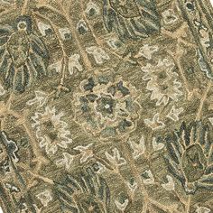 a close up view of an area rug with various colors and designs on it,