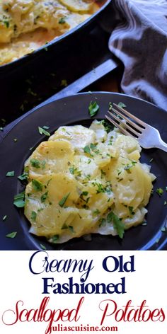 creamy old fashioned scalloped potatoes on a black plate with a fork in it