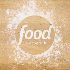 the food network logo is painted on a piece of wood that has been stained white