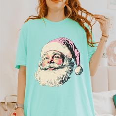 Fall in Love with Our Pink Christmas Vintage Shirt! This delightful tee combines retro charm with festive holiday vibes, making it an essential addition to your pink Christmas wardrobe. 🎀 Key Features: Soft & Comfortable: Crafted from premium materials, this shirt offers exceptional softness and comfort, perfect for all-day wear whether you're enjoying holiday activities or relaxing at home. Versatile Style: With its classic cut and enchanting design, this shirt transitions effortlessly from ca Cute Winter T-shirt With Graphic Print, Cute Short Sleeve T-shirt For Winter, Cute Holiday T-shirt With Crew Neck, Holiday Crew Neck Top With Cartoon Print, Cute Winter Graphic Print T-shirt, Cute Pink Christmas T-shirt, Cute Holiday Tops With Short Sleeves, Cute Short Sleeve Holiday Tops, Cute Christmas Holiday Tops