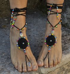 This listing is for a pair of black gipsy mandala barefoot sandals. Beautiful and unique barefoot sandals with a tribal vibration. Handmade crocheted with love and care using black waxed polyester cord, tibetan silver beads and czech seed beads. They will embellish your feet and you can wear it with sandals in a variety of styles from work to casual to evening attire. Beautiful to wear on a beach or garden wedding. Great and very comfortable for making yoga, hula hoop, belly dance and dancing. T Summer Festival Jewelry With Black Beads, Black Bohemian Anklets With Black Beads, Black Beaded Festival Anklets, Black Beaded Anklets For Festival, Black Bohemian Beaded Anklets, Adjustable Traditional Anklets For Party, Handmade Bohemian Black Barefoot Sandals, Black Handmade Bohemian Barefoot Sandals, Black Bohemian Handmade Barefoot Sandals