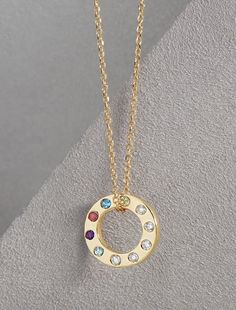 Celebrate the bonds of family with this exquisite Diamond Accented Personalized Birthstone Necklace, crafted from 14K solid gold. The elegant circle pendant can be customized with the genuine birthstones of your loved ones, making it a cherished keepsake for mothers and grandmothers. This necklace is more than just a piece of jewelry--it's a symbol of love, connection, and cherished memories. Gift it to a special woman in your life, or keep it as a beautiful reminder of your own family. ✪ DETAILS  * Offered in 14K Yellow, Rose, and White Gold (Stamped 14K for Purity Authenticity )  and 925 Sterling Silver. * Pendant Dimensions: 12 x 12 mm * Chain: 14K Yellow 1 mm Adjustable Diamond-Cut Cable 16-18" Chain * Weight : 2.53 Grams  * Stone Size: 1.5mm * Diamond Color Clarity: G-H, I1 * Customiz Hallmarked Round Birthstone Necklace For Anniversary, Round Hallmarked Birthstone Necklace For Anniversary, Mother's Day Round Yellow Gold Birthstone Necklace, Yellow Gold Round Birthstone Necklace Gold Plated, Yellow Gold Plated Round Birthstone Necklace, Round Birthstone Necklace With 17 Jewels For Anniversary, Gold Multi-stone Necklace For Anniversary, Multi-stone Round Pendant Necklace For Anniversary, Personalized Mother's Day Birthstone Necklace Round Pendant