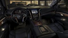 the interior of a luxury car with brown leather trims and dashboard, including steering wheel