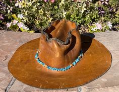 "Sedona Blanket company is thrilled to announce our new collection of handmade Hat bands! This beautiful hat band is hand made with Aqua marine crystals, wood beads and features Navajo style silver filled beads. Aquamarine crystals are said to evoke vibrations of happiness, hope and everlasting youth. Instantly add pizazz and uniqueness to ANY hat! Having several hatbands is so much fun, as you can tailor the look of your hat to any outfit! All of our hatbands are hand strung and one of a kind, Rustic Adjustable Handmade Hat Bands, Handmade Rustic Hat Band - One Size, Handmade Rustic Hat Band, Rustic Handmade Hat Bands For Festivals, Handmade Rustic Hat Bands For Rodeo, Rustic Handmade Hat Bands For Rodeo, Handmade Rustic Hat Band For Festivals, Rustic Handmade Festival Hat Bands, Handmade Rustic Rodeo Hat Bands