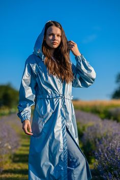 Azure Raincoat (summer collection) Season - spring-summer-autumn Style - casual (casual, minimalism) Size - Universal (width is suitable for S, M, L) Material - lightweight water-repellent material, gloss. Decorated with perforated fabric with a gradient pattern in soft blue color Contents: Nylon 80%, PE - 20%. Lining - unlined, internal seams with edging and sealing Fittings - metal fittings, gold (buttons, eyelets and snaps) made of stainless metal with a galvanic coating resistant to water and damage Packaging. - Reusable textile pouch bag, made of fabrics, tightened with a textile ribbon on top, can be used as a travel accessory, shoe cover or for storing other items - Gift box Design features - lightweight and not bulky - hood that fully protects from rain and wind - button fastener - Modern Hooded Raincoat For Spring, Lightweight Casual Spring Outerwear, Lightweight Outerwear For Outdoor Spring Activities, Lightweight Casual Outerwear In Solid Color, Casual Windbreaker For Everyday Spring Wear, Hooded Spring Outerwear For Everyday, Trendy Spring Raincoat For Rainy Weather, Spring Everyday Hooded Outerwear, Spring Outdoor Relaxed Fit Windbreaker