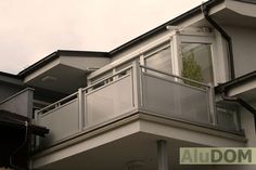 an apartment building with balcony and balconies