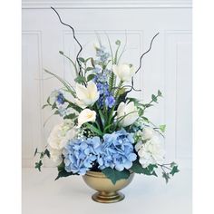 a vase filled with blue and white flowers