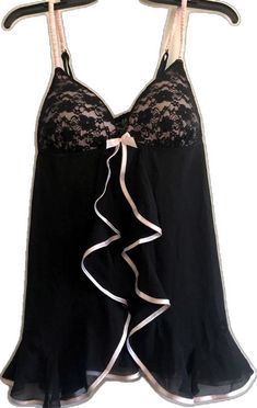 Feminine Fitted Black Sleepwear, Fitted Black Feminine Sleepwear, Fitted Feminine Black Sleepwear, Black Underwire Camisole With Lace Trim, Fitted Black Lace Trim Sleepwear, Black Stretch Sleepwear With Lace Trim, Black Feminine Camisole For Party, Black Coquette Nightgown For Bedtime, Black Feminine Camisole With Lace Trim