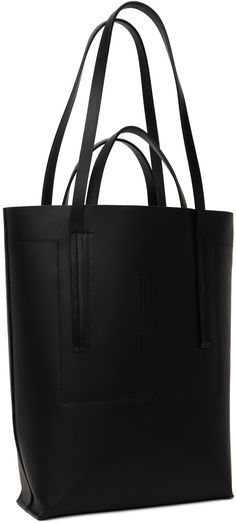 Structured heavyweight LWG-certified vegetable-tanned leather tote in black. · Twin carry handles · Twin shoulder straps · Topstitching and embossed logo at face · Open throat · Zip pocket and patch pockets at interior · Unlined · H13 x W20 x D6 Supplier color: Black Leather Shoulder Bag With Reinforced Double Handles, Leather Shoulder Bag With Double Handle And Reinforced Handles, Leather Tote Bag With Reinforced Handles, Shopper Tote, Embossed Logo, Vegetable Tanned Leather, Rick Owens, Leather Tote, Patch Pocket