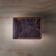 Sometimes you only need to carry the essentials.Handcrafted in the USA from the same North American Steerhide as the Tahoe Bifold Wallet, the scaled-down Slimline Bifold holds up to 8 credit cards and your currency in its small bill compartment.The perfect minimalist wallet for those who appreciate top quality materials and design. Tanned North American Steerhide. As the leather ages, the patina develops its own unique characteristics. Dimensions Closed 3-7/8" x2 7/8" Open 7 ½" 2 7/8" - Approx w Fun Wallets, Casual Belt, Reversible Belt, Unique Characteristics, Leather Bifold Wallet, Minimalist Wallet, Bifold Wallet, Gift Card Shop, Vintage Brown