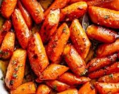 cooked carrots with herbs and seasoning in a pan