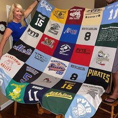 a man and woman holding up a blanket made from t - shirts on a chair