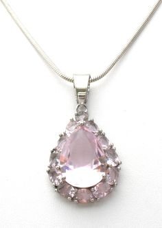 Vintage CZ Jewelry - This is a sterling silver snake chain with a pink ice cubic zirconia pendant. The pendant is 1.25" long (includes bale), .63" wide, and hallmarked 925. Chain is 18" long, hallmarked 925 four times, Italy twice. Total weight for the necklace and pendant is 7.3 grams. Pictures don't do this pendant justice. Pink Snake Chain Jewelry Gift, Pink Teardrop Pendant Necklace For Formal Occasions, Pink Sterling Silver Snake Chain Jewelry, Pink Teardrop Sterling Silver Necklace, Pink Sterling Silver Teardrop Pendant Necklace, Pink Sterling Silver Jewelry With Large Pendant, Pink Sterling Silver Necklace With Large Pendant, Silver Snake Chain, Cz Jewelry