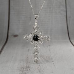 925 Sterling Silver Filigree Art Black Onyx Cross Pendant Necklace Pendant height: 2.30 inches and Width: 1.50 inches Chain Style: 18.00 inches +2.00 inches (extender) This metal embroidery filigree necklace is oxidized and highly polished. Black Onyx Gemstone is 12 mm cabochon round cut Filigree is a unique piece that incorporates handcrafted twisted threads of precious metal into its design. The metal is then soldered to the Silver jewelry and can take the shape of lacy flourishes, beautiful s Elegant Necklace With Large Cross Pendant, Elegant Cross Pendant Necklace With Large Pendant, Black Pendant Necklace With Intricate Design, Elegant Nickel-free Cross Jewelry, Black Sterling Silver Jewelry With Large Pendant, Elegant Onyx Jewelry With Large Pendant, Elegant Onyx Wire Wrapped Necklace, Black Filigree Pendant Jewelry, Sterling Silver Necklace With Large Black Pendant