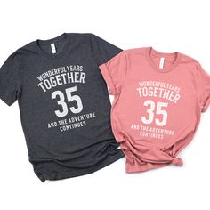 The 35 Wonderful Years Together And The Adventure Continues tee is a classic jersey short sleeve t-shirt that fits like a well-loved favorite. Perfect for active and leisure this t-shirt makes a great 35th wedding anniversary gift for a couple celebrating their 35th coral anniversary. Soft cotton and quality print make you fall in love with it over and over again. *Each shirt is sold separately. They do not come as a set so you can order the correct sizing for each shirt.* .: Crew neckline .: Ma Anniversary Crew Neck Shirt With Graphic Print, Anniversary Graphic Tee With Letter Print, Anniversary Graphic Print Crew Neck Shirt, Anniversary Graphic Tee With Text Print, Casual Short Sleeve T-shirt For Anniversary, White Pre-shrunk Tops For Anniversary, Graphic Tee With Short Sleeves For Anniversary, Anniversary Crew Neck Top With Graphic Print, Pre-shrunk Cotton T-shirt For Anniversary