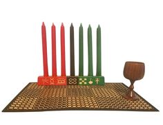 a set of seven candles on a table