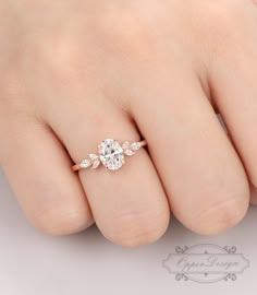 a woman's hand with a diamond ring on it