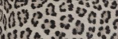 an animal print fabric with black and white spots