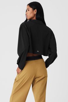 The Cropped Take Me Out Button Up is a year-round layer to wear on repeat. Made with a twill woven that’s lightweight yet warming along with hidden buttons for a sleek look, this cropped and collared long sleeve is the shacket, reimagined. Layer it over a bra top and leggings for an instant outfit that wears well anywhere. Alo Yoga Fall Workwear Outerwear, Alo Yoga Fall Outerwear For Work, Black Cropped Jacket With Button Closure, Alo Yoga Long Sleeve Workwear Outerwear, Alo Yoga Long Sleeve Outerwear For Work, Fall Layering Tops By Alo Yoga, Spring Casual Alo Yoga Outerwear, Casual Alo Yoga Spring Outerwear, Alo Yoga Tops For Fall Layering