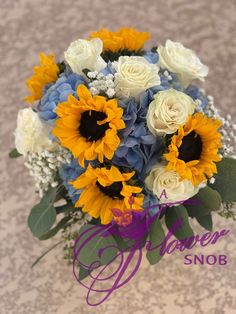 a bouquet of sunflowers and blue hydrangeas