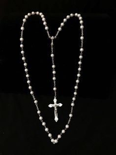 Handmade Rosary made with stainless steel eyepins, silvertone chain,  6mm glass pearl beads.  Cross is 1 7/8 inch and centerpiece is 3/4 inch , they are silver oxidized and made in Italy.  Perfect for that First Holy Communion gift... Comes with a black pouch with or without cross on it and gift box. Please specify in messages if you want a cross on the pouch. Silver Metal Jewelry With 8mm Beads, Silver Pearl Necklace With 8mm Beads For Gift, Spiritual Silver Jewelry With Pearl Chain, Spiritual Silver Pearl Necklace With Round Beads, Silver Beaded Chain Rosary As Gift, Elegant Silver Rosary For First Communion, Silver Pearl Rosary With 8mm Beads, Silver Rosary For Baptism, Adjustable Silver Pearl Rosary