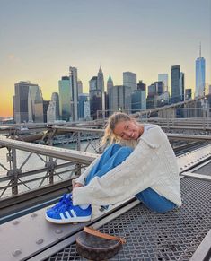 greta wilson sitting on brooklyn bridge