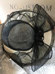 Beautiful black, woven straw hat. Black Straw Hat With Curved Brim, Fitted Black Straw Hat With Wide Brim, Black Short Brim Boater Hat For Church, Black Fedora Sun Hat For Kentucky Derby, Black Short Brim Summer Fascinator, Black Brimmed Boater Hat For Evening, Black Wide Brim Fascinator For Summer, Black Curved Brim Boater Hat For Church, Black Brimmed Hats For Church