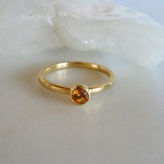 Elegant 14K Gold Ring with 4mm Bezel Set Citrine - November Birthstone Jewelry, size 7 Add a touch of sophistication to your jewelry collection with this stunning 14K gold ring featuring a 4mm bezel set citrine. Perfect as a November birthstone gift or a timeless piece for any occasion, this ring showcases both elegance and craftsmanship. Specifications: Weight: 1.78 DWT (2.77 grams) Primary Stone Count: 1 stone Stone Type: Citrine Stone Setting: Bezel Material: 14K Yellow Gold Ring Fit: Standar November Birthstone Jewelry, Citrine Jewelry, Bezel Set Ring, November Birthstone, Citrine Ring, Citrine Stone, 14k Gold Ring, Ring Fit, Minimalist Rings