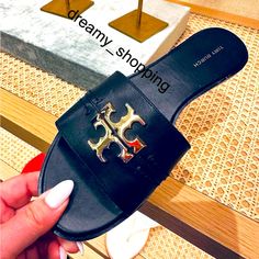 Brand New In Box Tory Burch Black Everly Slide Sandals Calf Leather With Shiny Full Iconic Brand Gold Logo Discontinued And Hard To Find Leather Upper And Lining Rubber Sole Shiny Gold Full Logo Made In Vietnam Please Note: Dust Bag Is Not Included. 100% Authenticity Guaranteed. All Of Our Brand New Items Are Purchased From The Brand/Boutique/Company Store Directly. Due To Income Tax And Authenticity Purposes We Have Original Store Receipt For Every Item We Sell. Please Feel Free To Email Any Qu Chic Tan Flat Heel Sandals, White Tory Burch Sandals, Tory Burch Sandals Sparkly, Tory Burch Sandals Black, Yellow Tory Burch Sandals, Miller Sandal, Tory Burch Miller, Gold Logo, Tory Burch Miller Sandal