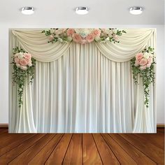 the backdrop is decorated with flowers and greenery