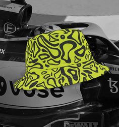 🌟 Introducing the Lando Norris Formula 1 Bucket Hat! 🏎️☀️ Rev up your style with the ultimate accessory for every F1 fan - the McLaren Driver from  Formula 1 Bucket Hat! 🧢 Whether you're cheering from the stands or cruising around town, this hat is your ticket to sleek, sporty vibes and undeniable cool. Imagine yourself on the track, feeling the thrill of speed and precision - that's the energy our bucket hat brings to your everyday look! Lando Norris Bucket Hat isn't just headgear; it's a st Carlos Sainz Bucket Hat, Lando Norris Hungary Helmet, Bucket Hat Prints, Racetrack Hat, F1 Cap, Graphic Bucket Hat, Crochet Bucket Hat, Lando Norris, Bucket Hats