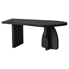 a black wooden table with an oval shaped top