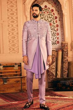 Lilac hand embroidered sherwani featuring sequin, moti work and french knots in a geometric pattern crafted in raw silk fabric. Paired with draped kurta and pant.
Components: 3
Pattern: Embroidered
Type Of Work: Thread
Neckline: Band collar
Sleeve Type: Long
Fabric: Raw Silk, Satin
Color: Purple
Other Details: 
Approx. product weight: 2.2 kgs
Occasion: Mehendi and Puja - Aza Fashions Designer Ceremonial Kurta With Mirror Work, Designer Nehru Jacket With Mirror Work For Eid, Designer Bandhgala With Mirror Work, Formal Sherwani With Mirror Work, Designer Kurta With Mirror Work For Eid, Designer Resham Embroidery Kurta For Reception, Designer Eid Kurta With Mirror Work, Designer Art Silk Sherwani With Chikankari Embroidery, Designer Festive Bandhgala With Mirror Work