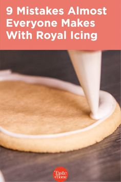 a cookie being frosted with royal icing